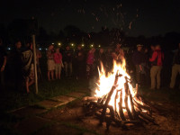 A group gathered around a bonfire