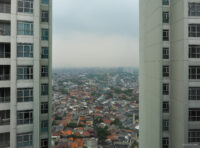 View from my window: low-rise dwellings dwarfed between residential tower blocks
