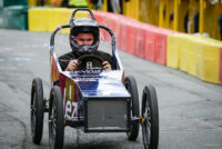 Action photo of a soapbox cart going down the hill